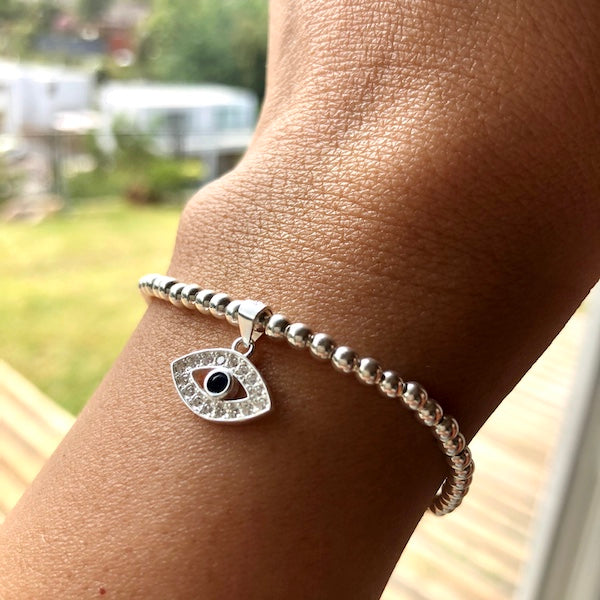 Pulsera Bolitas y Ojo con Circón